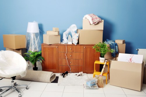 Man and van removal service loading furniture in The Burroughs