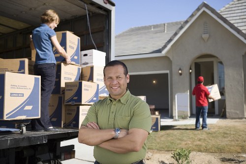 Careful furniture handling during a house move in The Burroughs