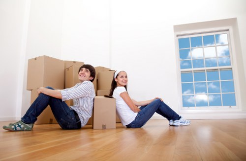 Professional moving team loading furniture for a home or apartment move