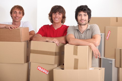 Local moving team preparing boxes and equipment for transport