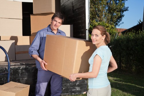 Professional movers handling office furniture and equipment locally